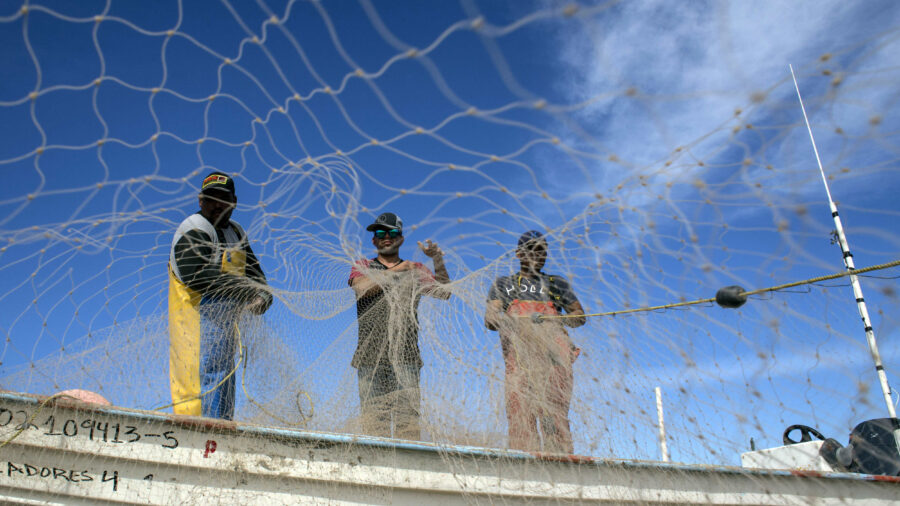 Fishermen prepare their nets in the Gulf of California near San Felipe, Mexico. Credit: Guillermo Arias/AFP via Getty Images