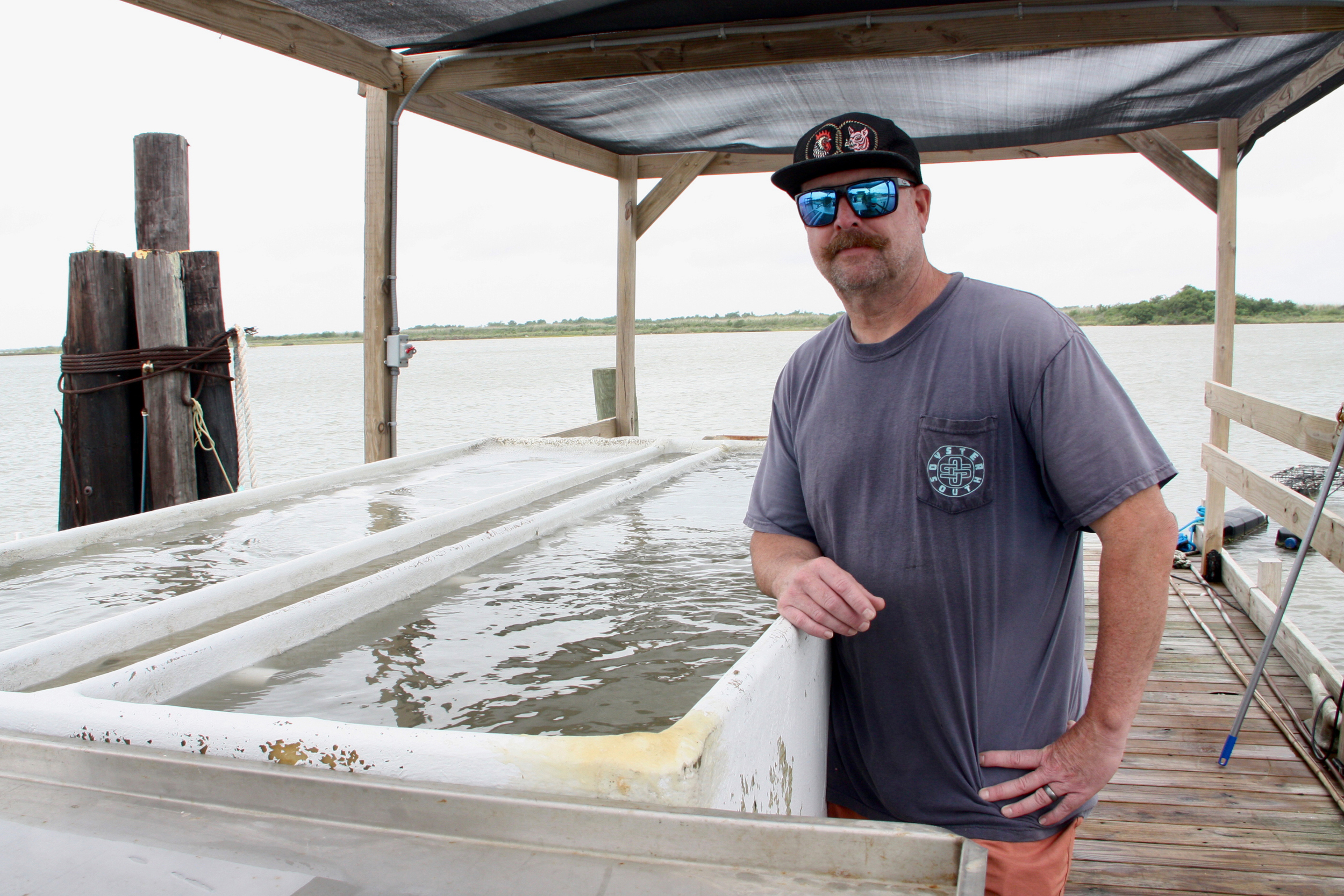 David Sorrells owns an oyster farm in Calcasieu Lake. The vast majority of its oysters have been unfit for sale since an LNG company’s dredging operation spilled mud beyond its boundaries last year, according to a lawsuit. Credit: Nicholas Kusnetz/Inside Climate News