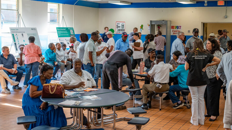 Hayneville residents gather in a middle school now closed due to a declining local population for an open house with developers of a proposed hyperscale data center campus. Credit: Lee Hedgepeth/Inside Climate News