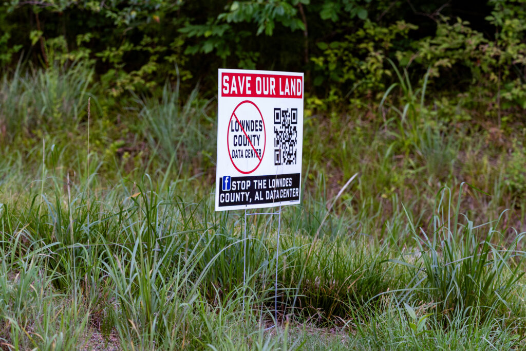 Signs opposing the data center development are as common as summer wildflowers in Lowndes County. Credit: Lee Hedgepeth/Inside Climate News