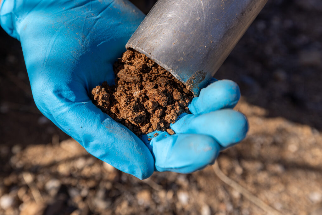 Justin Stewart, an evolutionary ecologist at SPUN, samples soil in Tucson, Ariz. Credit: John Burcham/SPUN