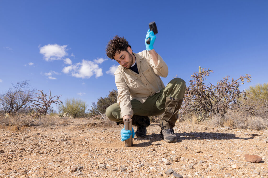 Justin Stewart, an evolutionary ecologist at SPUN, samples soil in Tucson, Ariz. Credit: John Burcham/SPUN