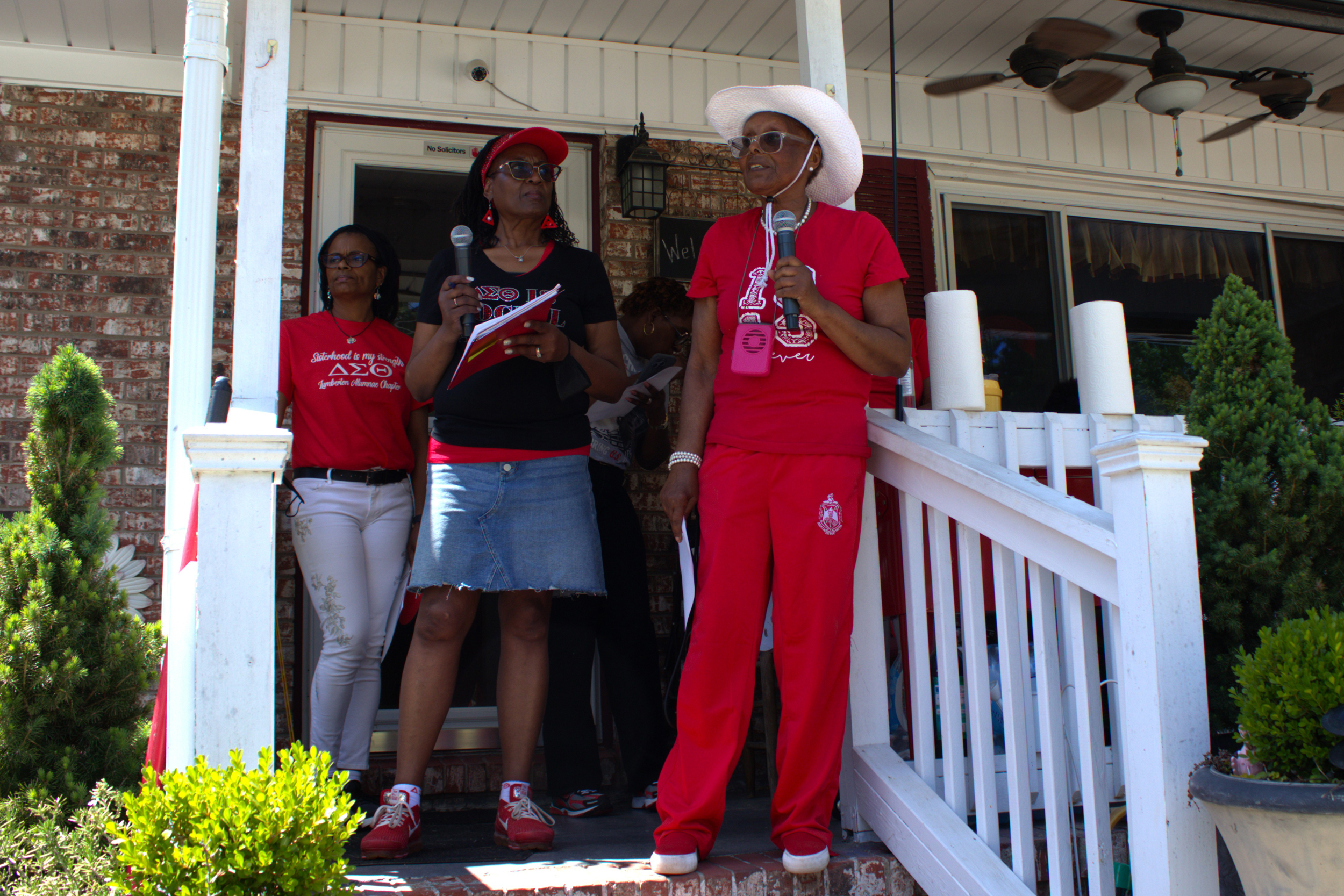 Viv Tolson Wayne rallies her sorority sisters and other communities from her front porch in St. Pauls on April 18. Credit: Morgan Casey