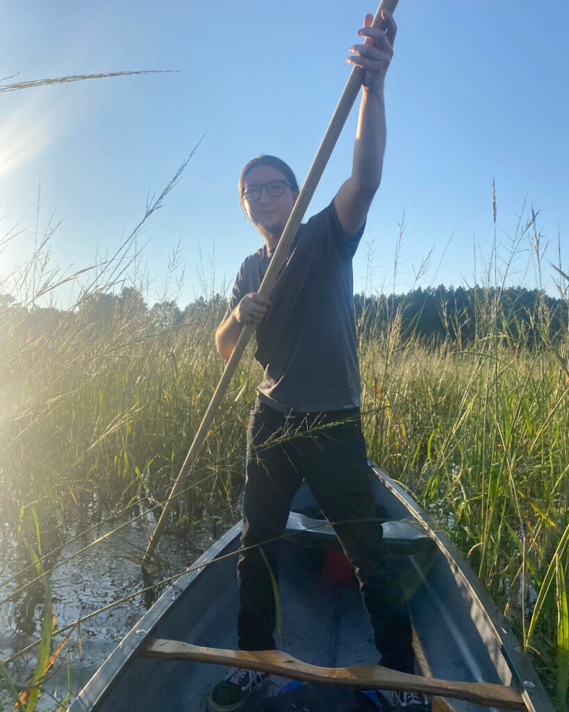 Bazile Minogiizhigaabo Panek, a member of the Red Cliff Band of Lake Superior Chippewa, harvests wild rice in Wisconsin. Credit: Ursula Charles