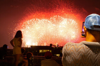 People watch a July 4 fireworks show that lit up the skies above Nationals Park in Washington, D.C. Credit: Gabriel Matias Castilho/Inside Climate News