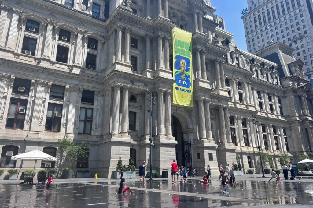 Children play in sprinklers in front of Philadelphia City Hall on July 2. Credit: Nina Sablan/Inside Climate News