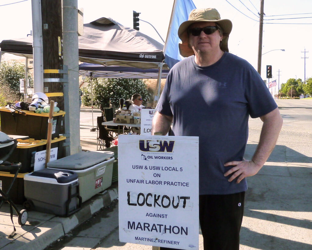 Bob Bulman, a field operator at Marathon’s Martinez Renewables refinery, stands on the picket line on July 16, the 81st day of a workers’ strike for safer conditions. Credit: Liza Gross/Inside Climate News