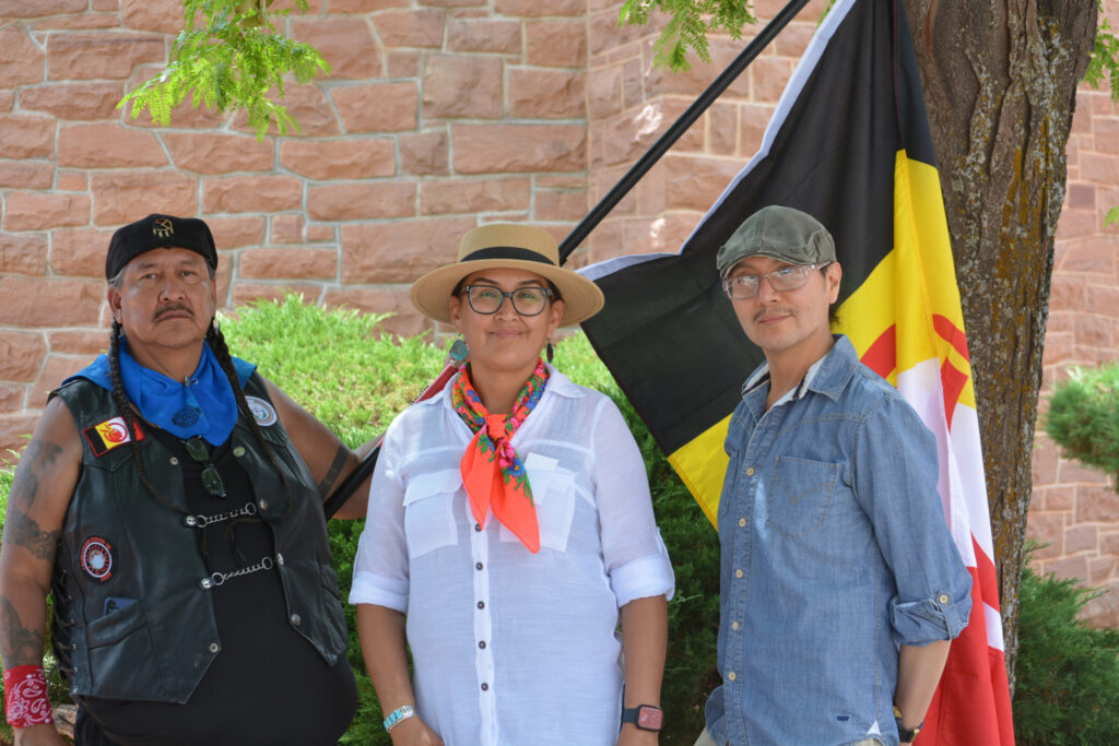Gilfred Hogue, Joni Lapahie and Dáilan Long pose for a portrait at the press conference against a proposed coal mine expansion near their homes on July 20 at Window Rock, Ariz. Credit: Wyatt Myskow/Inside Climate News