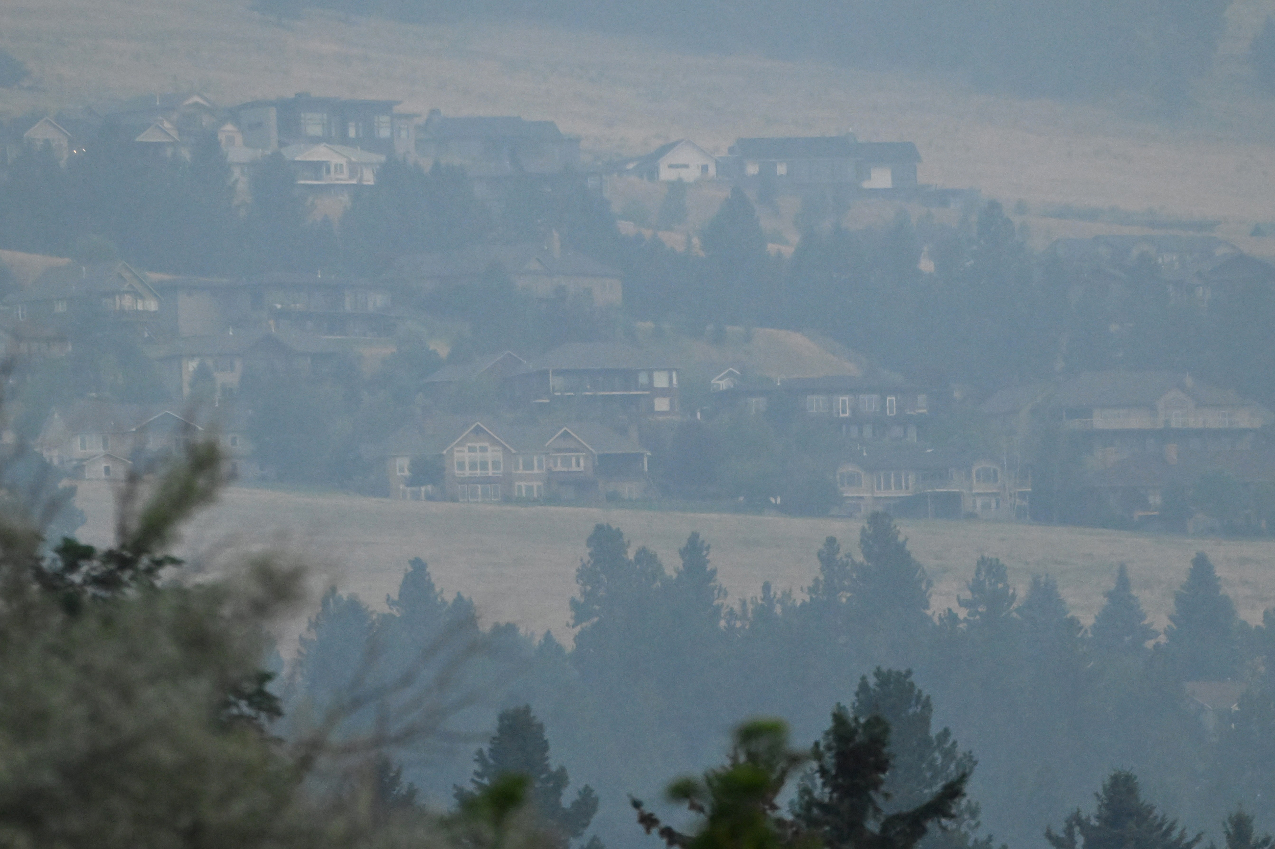 Wildfire smoke blankets homes in Missoula, Mont., on July 26. Credit: Mosabber Hossain/Inside Climate News