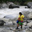 Claudia Rondan, an environmental defender from the Emberá Indigenous community, walks on the banks of Colombia’s Atrato River in Choco on Aug. 29, 2024. Credit: Raul Arboleda/AFP via Getty Images