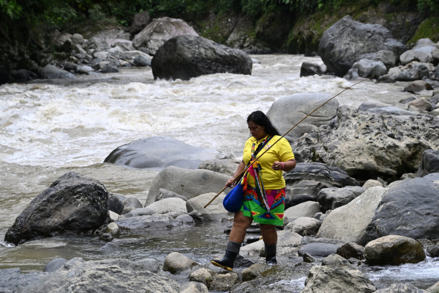 Claudia Rondan, an environmental defender from the Emberá Indigenous community, walks on the banks of Colombia’s Atrato River in Choco on Aug. 29, 2024. Credit: Raul Arboleda/AFP via Getty Images