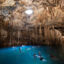 Visitors swim in the water at the Cenote Xkeken near Chichén Itzá in Yucatán, Mexico. Credit: Sebastian Kahnert/dpa via Getty Images