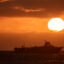 A commercial fishing boat is seen off the coast of San Diego as the sun sets on July 5, 2025. Credit: Kevin Carter/Getty Images