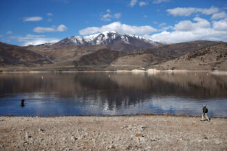 People fish along the Deer Creek Reservoir near Heber City, Utah, on Feb. 7, as the state experiences about one-third of its normal early-February snowpack. Credit: Mario Tama/Getty Images