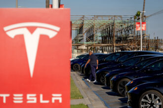 Electric vehicles sit at a Tesla dealership on April 8 in Long Beach, Calif. Credit: Eric Thayer/Los Angeles Times via Getty Images