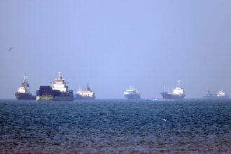 Ships sit anchored in the Strait of Hormuz in southern Iran on May 4. Credit: Amirhossein Khorgooei/AFP via Getty Images