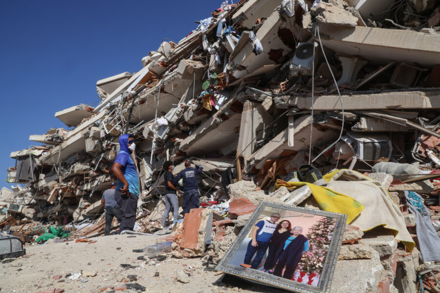 People and rescuers search for victims amid debris of a demolished building on June 27 in La Guaira, Venezuela, after a 7.2-magnitude earthquake struck the region. Credit: Edilzon Gamez/Getty Images