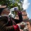 A Revolutionary War reenactor drinks water in the shade near Independence Hall during high temperatures on July 3 in Philadelphia. Credit: Al Drago/Getty Images