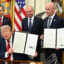 President Donald Trump and Utah Gov. Spencer Cox display executive orders Trump signed to shrink two national monuments in Utah at the Oval Office of the White House on July 13. Credit: Saul Loeb/AFP via Getty Images