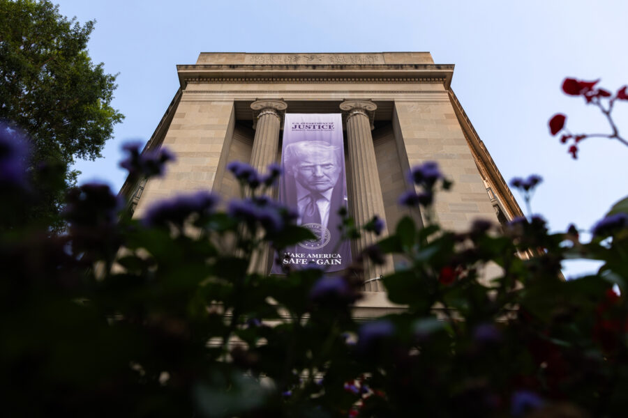 A banner of President Donald Trump hangs from the Department of Justice headquarters on July 14 in Washington, D.C. Credit: Finn Gomez/Getty Images