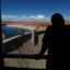 Visitors view the Glen Canyon Dam and Lake Powell from the Carl Hayden Visitor Center on Thursday in Page, Ariz. Credit: Justin Sullivan/Getty Images