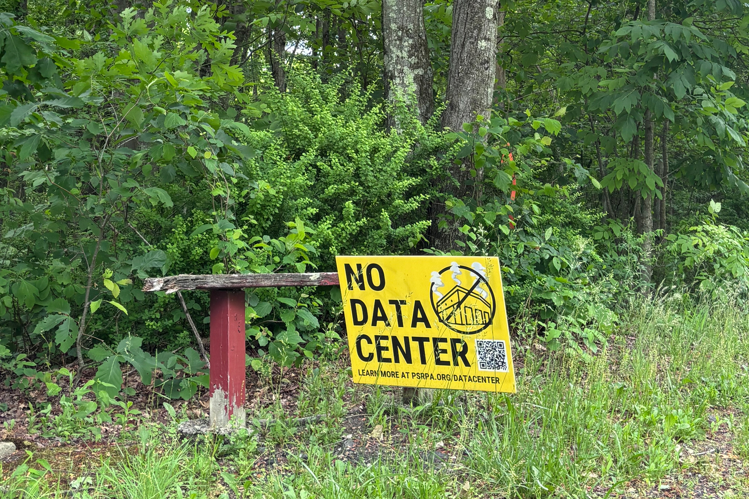 Data center opposition signs are seen around the neighborhood next to the project site in Devil’s Mountain. Credit: Nina Sablan/Inside Climate News