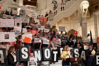 Ginny Marcille-Kerslake, an organizer for Food & Water Watch, speaks at the Pennsylvania State Capitol rotunda during a data center moratorium rally. Credit: Courtesy of Food & Water Watch