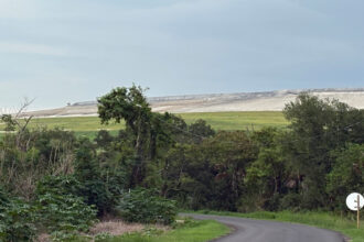 The radioactive phosphogypsum stack sits next to the community of Progress Village in Florida. Credit: Amy Green/Inside Climate News