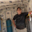 Mike Watters stands in a granular activated carbon filtration system that Chemours was required to give him after his well in Grays Creek was contaminated with several types of PFAS. Credit: Mehmet Demirci/Inside Climate News