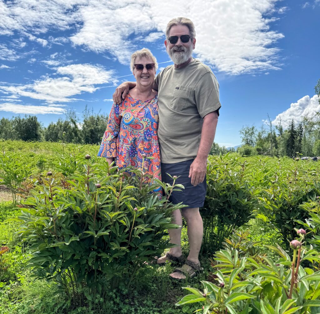 This is a portrait of Mike and Paula Williams, owners of EagleSong Peony Farm. Photo by Paula Dobbyn