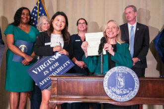 Virginia Delegate Irine Shin (left) stands with Gov. Abigail Spanberger during a RGGI bill signing event in Richmond on June 30. Credit: Phuong Tran/SELC