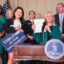 Virginia Delegate Irine Shin (left) stands with Gov. Abigail Spanberger during a RGGI bill signing event in Richmond on June 30. Credit: Phuong Tran/SELC