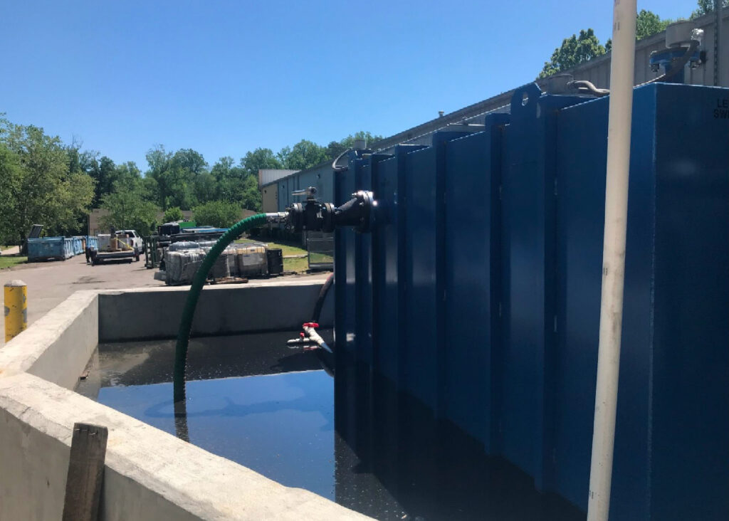 A secondary containment for the oil and water separator was full of water and petroleum products. The mix couldn’t be discharged into the sewer because it contained benzene. Credit: NCDEQ