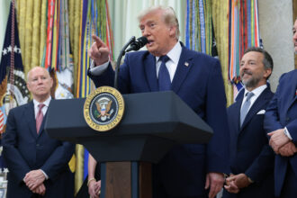 President Donald Trump talks to reporters in the Oval Office on Monday about the energy demands of AI and data centers. Credit: Anna Moneymaker/Getty Images