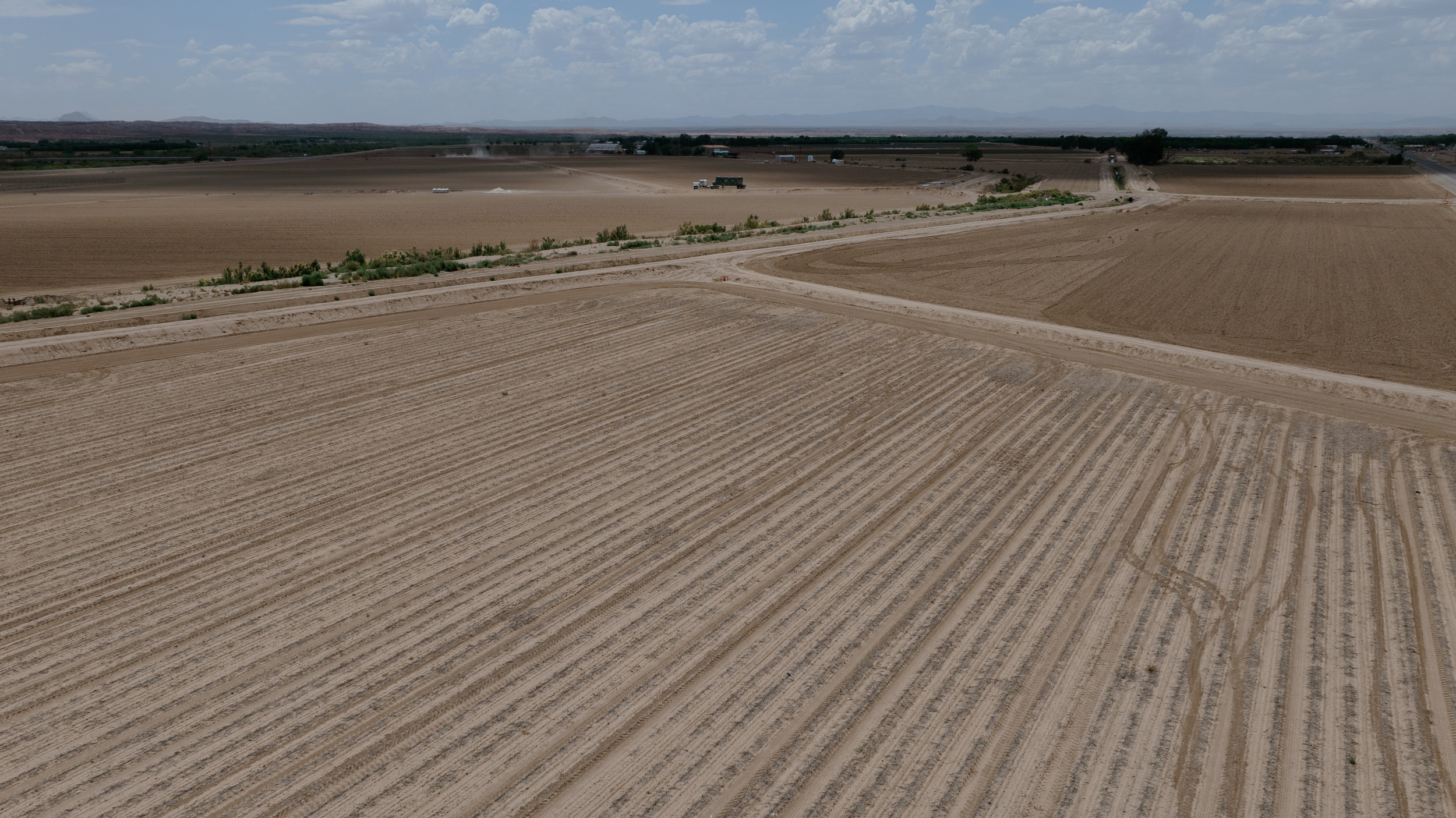 A view of fallowed fields in Hatch, N.M., on June 10. The state of New Mexico pays farmers to temporarily fallow their fields to reduce strain on the aquifer.