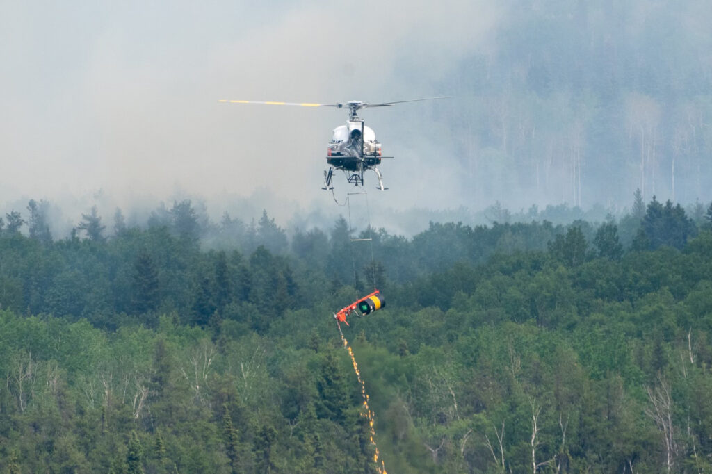 Federal firefighting personnel from the U.S. provide wildfire suppression support in Canada in June 2025. Credit: National Interagency Fire Center