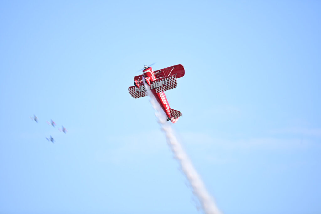 A piston-engine aircraft during an airshow at AirVenture. Credit: Andrew Liu/Inside Climate News
