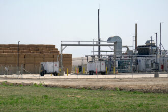 H2B2 Electrolysis Technologies equipment sits next to the Bar 20 dairy farm in Kerman, Calif. Credit: Steven Rodas/Inside Climate News