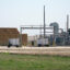 H2B2 Electrolysis Technologies equipment sits next to the Bar 20 dairy farm in Kerman, Calif. Credit: Steven Rodas/Inside Climate News