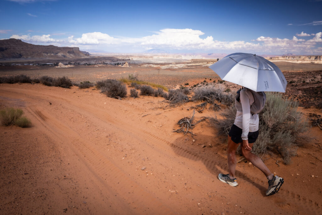 Mina Guli jogs with a shade umbrella through the Grand Canyon area on July 22. Credit: Sunny Stroeer