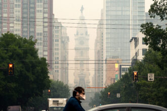 Wildfire smoke blankets Philadelphia on June 7, 2023. Credit: Joe Lamberti/AFP via Getty Images
