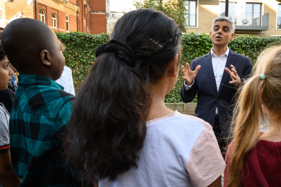 London Mayor Sadiq Khan speaks to a group of primary school children before delivering a speech on his plans to help reduce pollution and carbon emissions on Sept. 23, 2021. Credit: Leon Neal/Getty Images