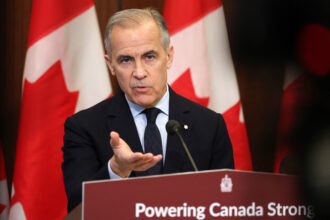 Canadian Prime Minister Mark Carney speaks about clean energy initiatives during a news conference on May 14 in Ottawa. Credit: Dave Chan/AFP via Getty Images
