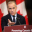 Canadian Prime Minister Mark Carney speaks about clean energy initiatives during a news conference on May 14 in Ottawa. Credit: Dave Chan/AFP via Getty Images