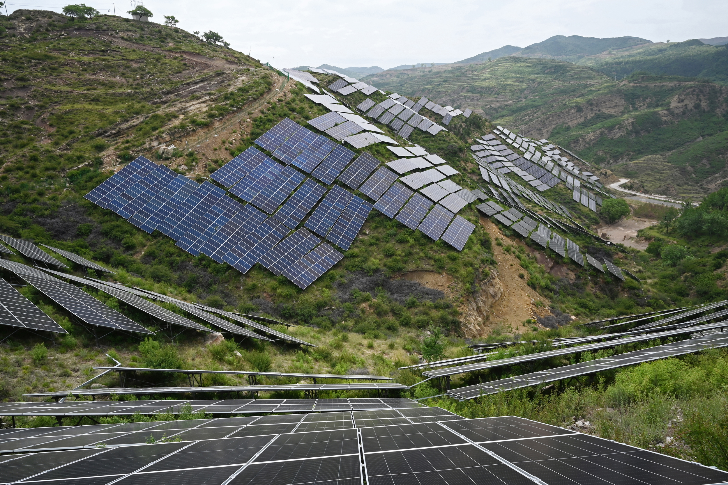 Solar panels fill a hillside near Jiexiu, China. Credit: Greg Baker/AFP via Getty Images