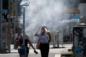 People cool down during a heatwave as temperatures reach 100 degrees Fahrenheit on June 30 in Vienna, Austria. Credit: Joe Klamar/AFP via Getty Images