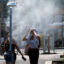 People cool down during a heatwave as temperatures reach 100 degrees Fahrenheit on June 30 in Vienna, Austria. Credit: Joe Klamar/AFP via Getty Images
