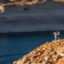 People stand at the bottom of a boat ramp that now ends hundreds of feet above the water levels of Lake Powell on Aug. 18 near Page, Ariz. Credit: David McNew/Getty Images