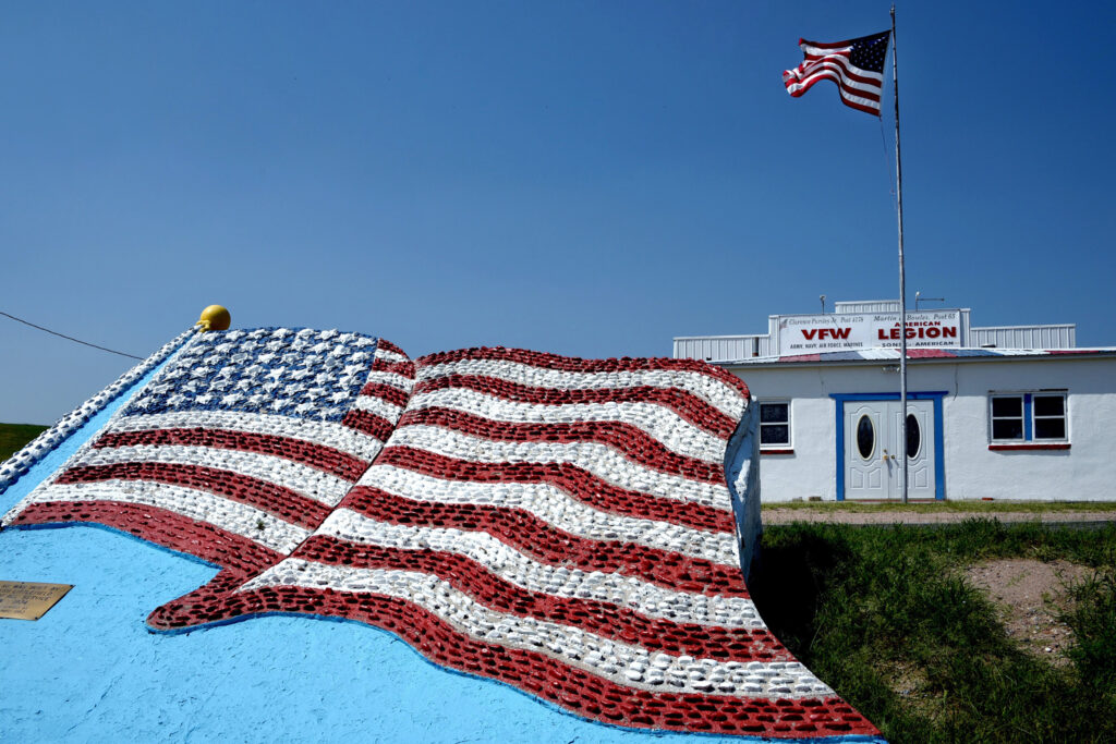 Outside the Benkelman VFW and American Legion post, a U.S. flag of concrete was built in 1934 by Dick and Jess Littlefield to honor service members. Credit: Sonya Doctorian/Inside Climate News