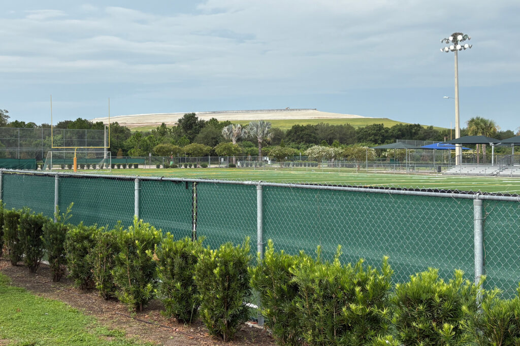 The phosphogypsum stack is right behind a recreation center and sports complex and near a middle school. Credit: Amy Green/Inside Climate News